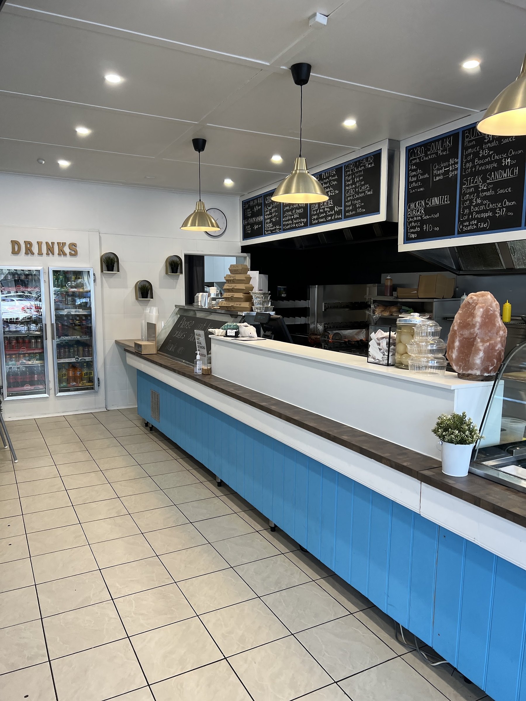 The Mr Beau counter under the brass lamps