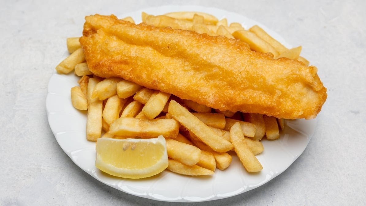 Battered flake and chips with lemon